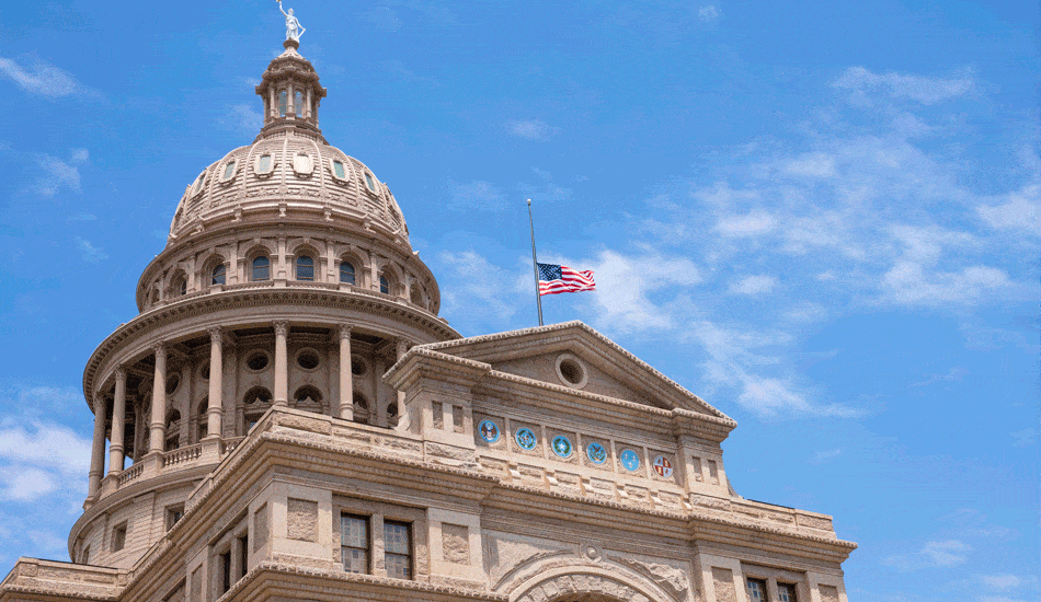 The American flag over the Texas capitol